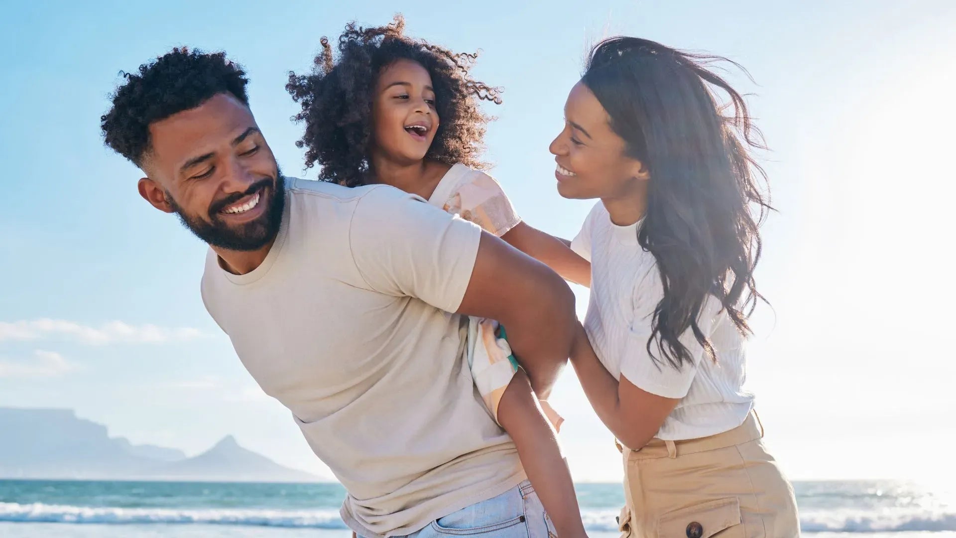 A family enjoying a winter vacation at a cozy cabin, surrounded by snow and holiday decorations.
