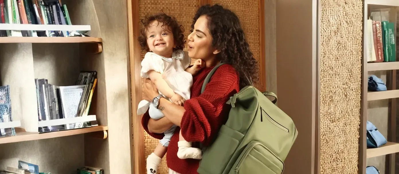 A well-organized infant diaper bag packed with essential baby items like diapers, wipes, and bottles.